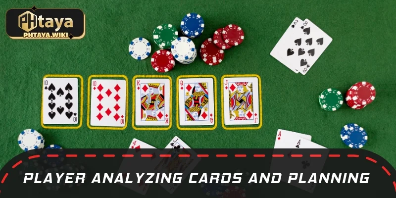 Player analyzing cards and planning moves